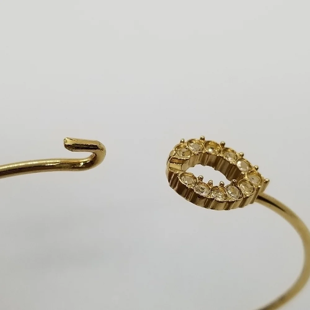 gold tone bracelet with pave rhinestone teardrop clasp